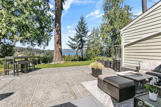 view of patio featuring an outdoor fire pit