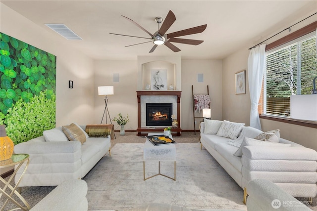 19301 87th Avenue Ct E, Graham, WA 98375 - living area with a ceiling fan, a lit fireplace, baseboards, carpet flooring, and visible vents