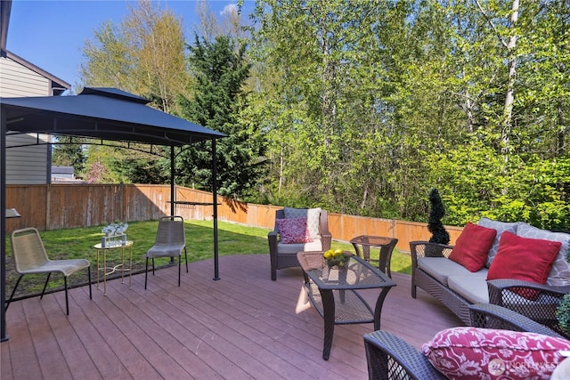 19301 87th Avenue Ct E, Graham, WA 98375 - wooden deck with a fenced backyard, outdoor lounge area, a gazebo, and a lawn