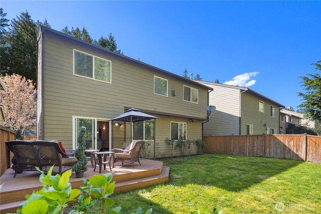 19301 87th Avenue Ct E, Graham, WA 98375 - rear view of property featuring a fenced backyard, a wooden deck, and a yard