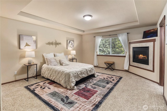 19301 87th Avenue Ct E, Graham, WA 98375 - carpeted bedroom with a fireplace, a raised ceiling, and baseboards
