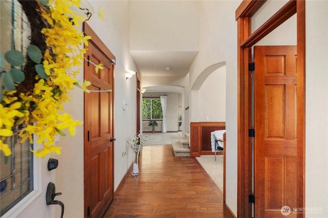 19301 87th Avenue Ct E, Graham, WA 98375 - corridor with arched walkways, baseboards, and dark wood-style floors