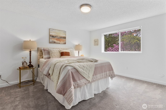 carpeted bedroom featuring baseboards and a textured ceiling