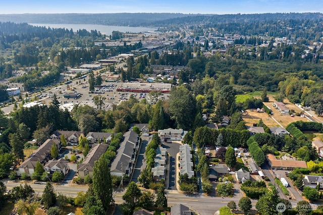 birds eye view of property with a wooded view
