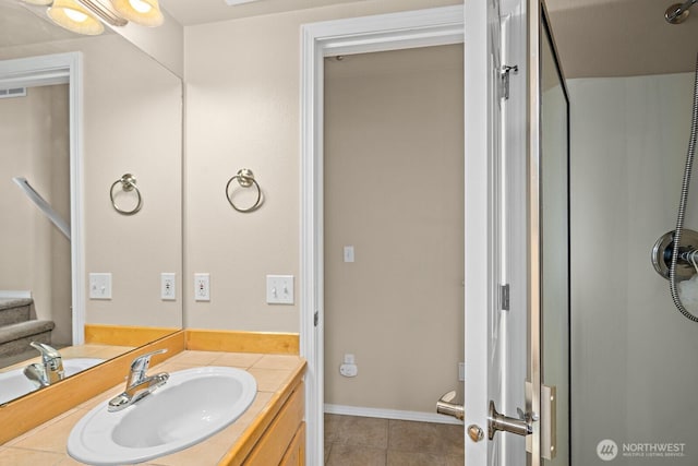 bathroom featuring tile patterned floors, visible vents, and vanity