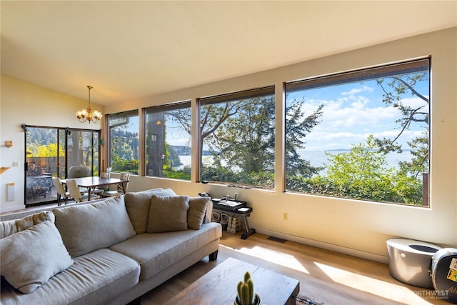 12724 Marine Dr, Anacortes, WA 98221 - sunroom / solarium featuring visible vents and a notable chandelier