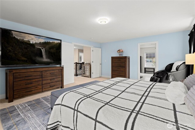 carpeted bedroom featuring baseboards