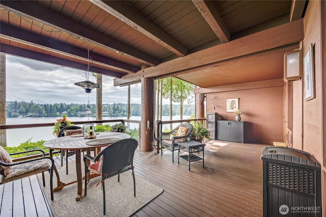 wooden terrace with a water view