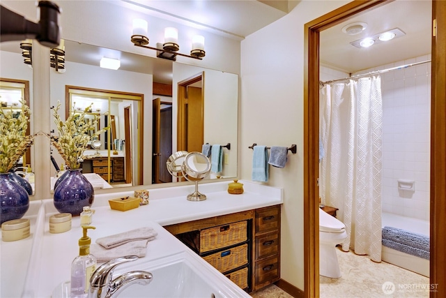 full bath with a shower with curtain, toilet, and vanity
