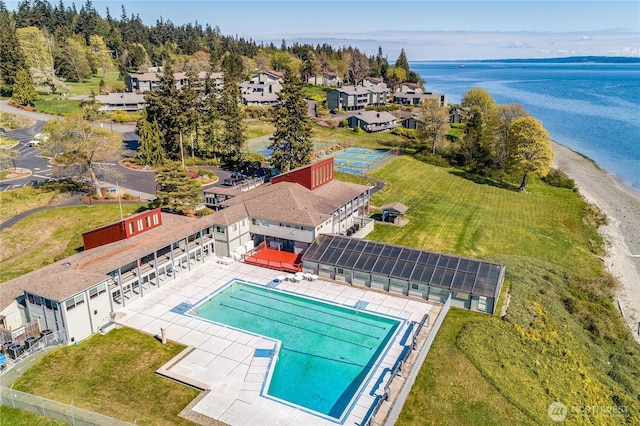 bird's eye view of a large body of water and a pool area