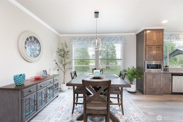 dining space with recessed lighting, ornamental molding, and light wood-style flooring