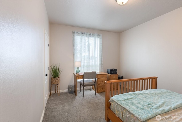 bedroom featuring light colored carpet and baseboards