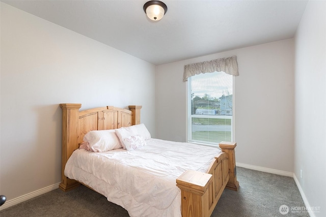 bedroom with baseboards and carpet floors