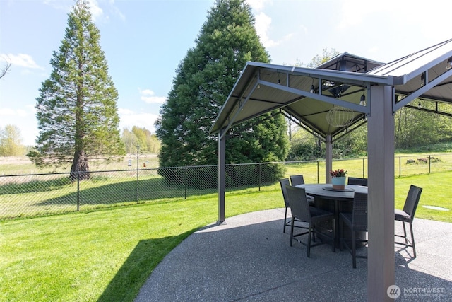 view of patio / terrace featuring fence and outdoor dining space
