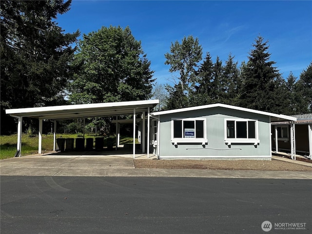 201 Union Ave SE Unit 251, Renton, WA 98059 - manufactured / mobile home featuring a carport and driveway