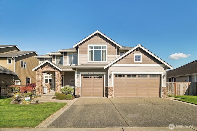 1207 24th St NW, Puyallup, WA 98371 - craftsman house with stone siding, driveway, and an attached garage