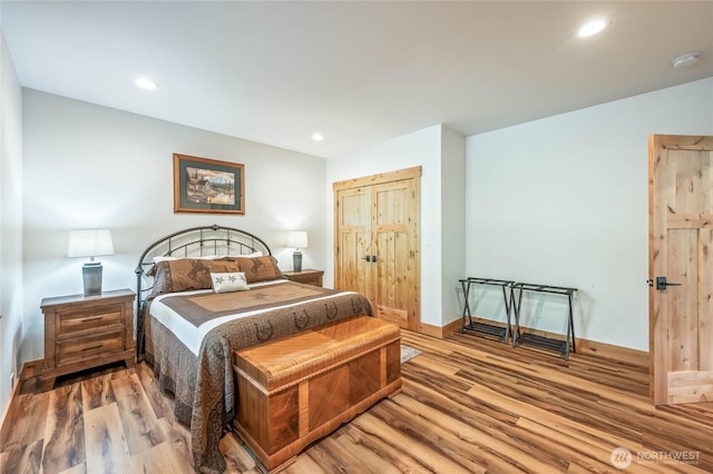 bedroom featuring recessed lighting, baseboards, and wood finished floors