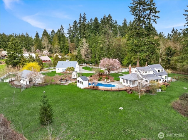 drone / aerial view with a view of trees