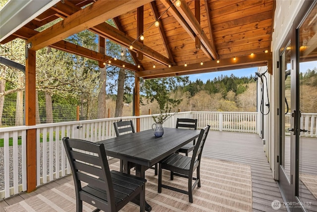 wooden deck with outdoor dining area