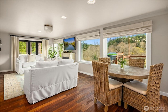 dining room with dark wood finished floors and baseboards