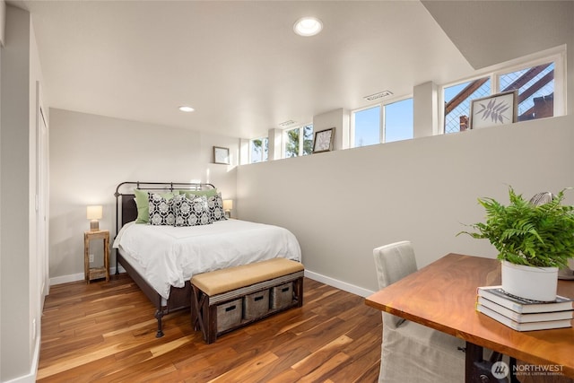 bedroom featuring baseboards, recessed lighting, wood finished floors, and visible vents