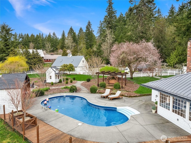 outdoor pool with a patio and fence