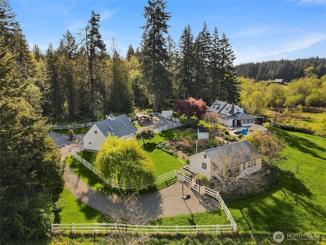 bird's eye view featuring a wooded view