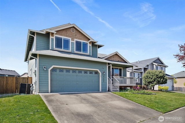 craftsman inspired home with driveway, covered porch, a front yard, fence, and a garage