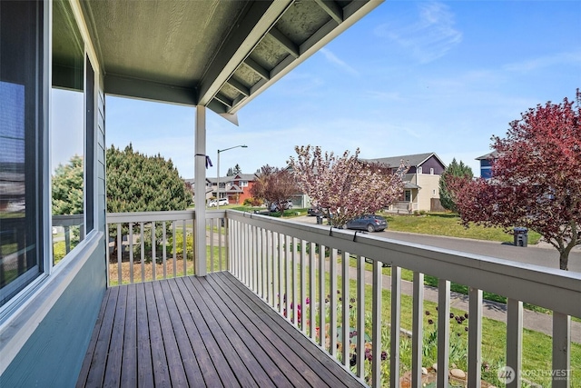 wooden deck with a residential view
