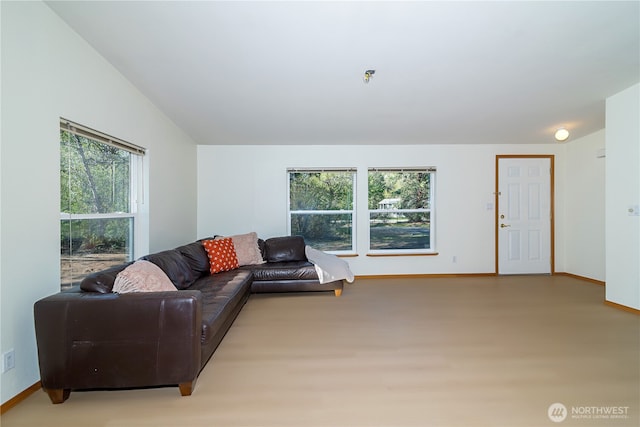 living area with baseboards and light wood-type flooring