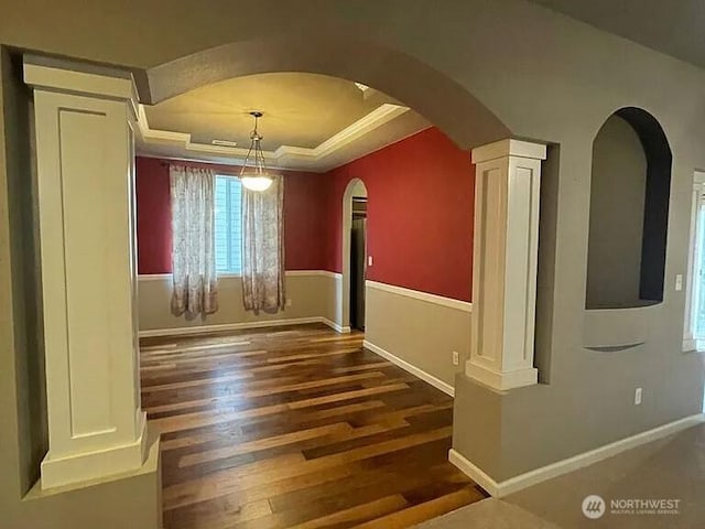 19020 25th Ave E, Tacoma, WA 98445 - unfurnished room with arched walkways, wood finished floors, baseboards, ornamental molding, and a tray ceiling