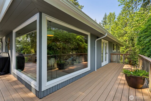 wooden deck featuring grilling area