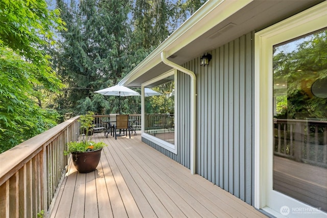wooden deck with outdoor dining area