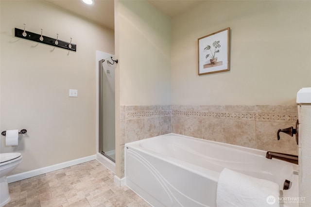 full bathroom featuring toilet, a shower stall, a bath, baseboards, and recessed lighting