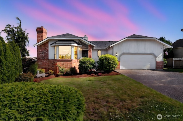 1823 19th Dr, Mukilteo, WA 98275 - ranch-style home featuring a chimney, brick siding, asphalt driveway, an attached garage, and a lawn