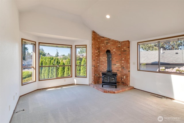 1823 19th Dr, Mukilteo, WA 98275 - unfurnished living room featuring a wood stove, carpet, vaulted ceiling, and recessed lighting