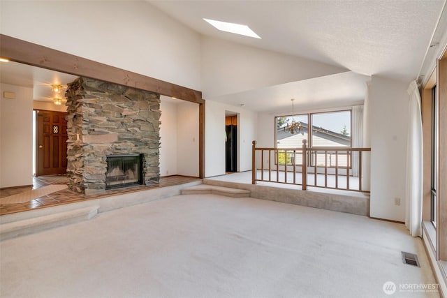 1823 19th Dr, Mukilteo, WA 98275 - unfurnished living room featuring light carpet, a fireplace, a skylight, and high vaulted ceiling