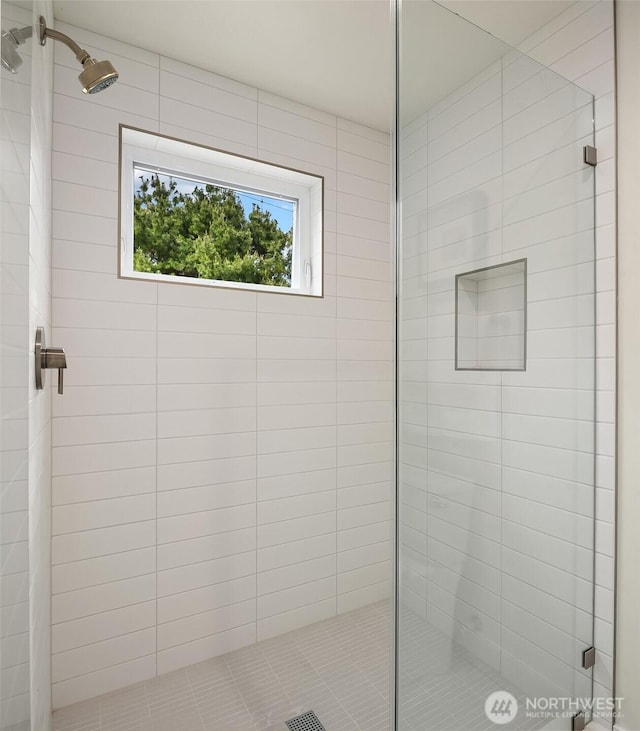 bathroom with a shower stall