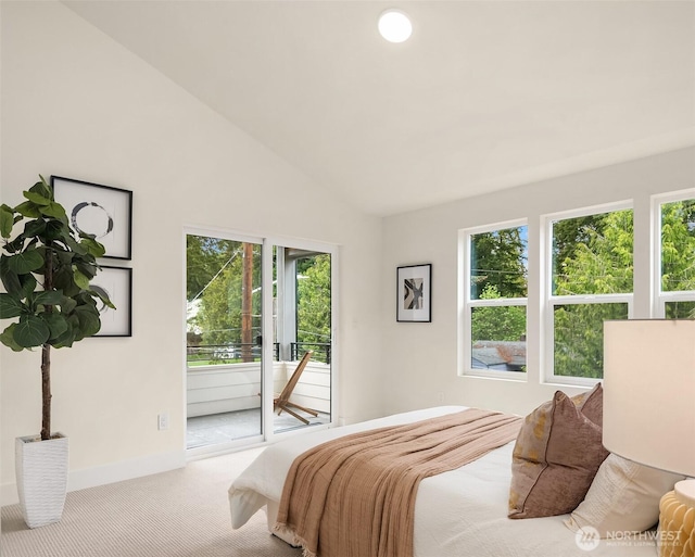 bedroom featuring carpet flooring, access to outside, multiple windows, and lofted ceiling