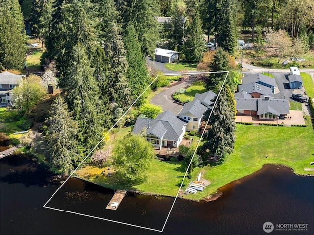drone / aerial view with a residential view and a water view