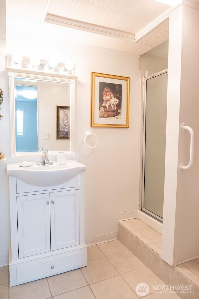 609 W Whitman Dr, College Place, WA 99324 - full bathroom with a stall shower, vanity, tile patterned floors, and baseboards