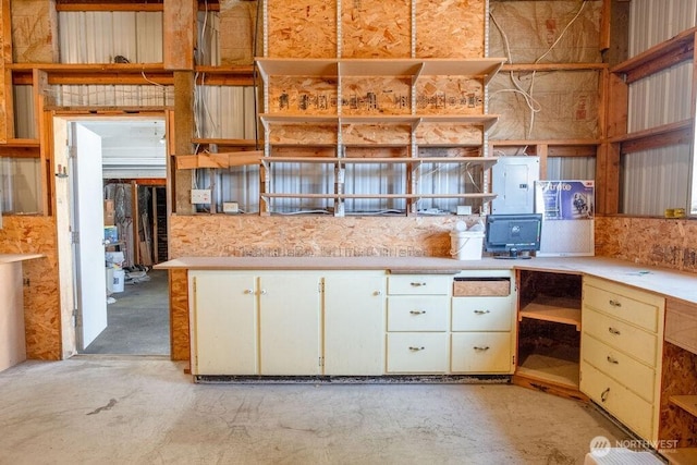 609 W Whitman Dr, College Place, WA 99324 - kitchen with open shelves, concrete floors, light countertops, and electric panel