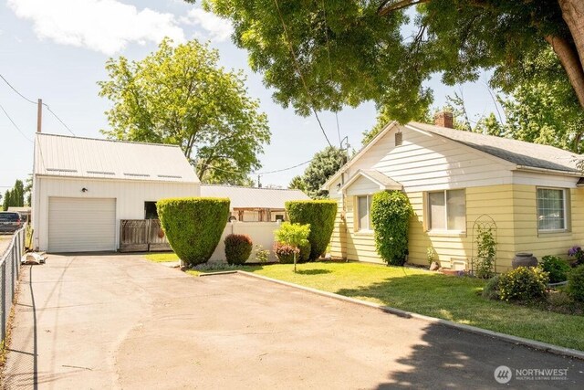 609 W Whitman Dr, College Place, WA 99324 - view of front of home featuring driveway and a chimney