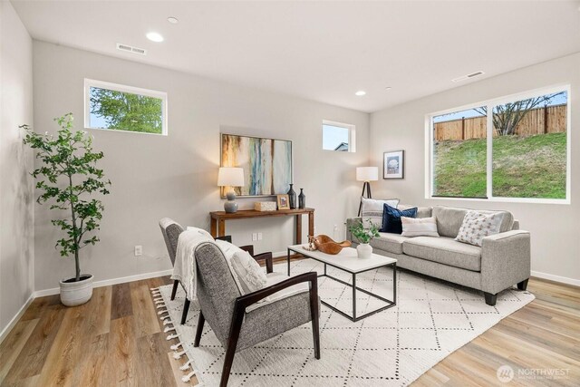 19504 15th Ave E, Spanaway, WA 98387 - living area with baseboards, plenty of natural light, and visible vents