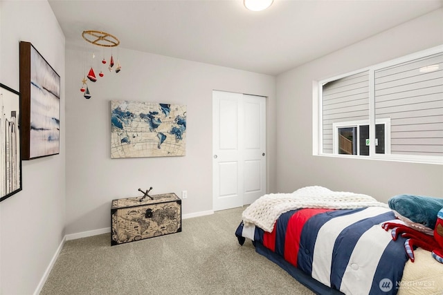 carpeted bedroom with baseboards