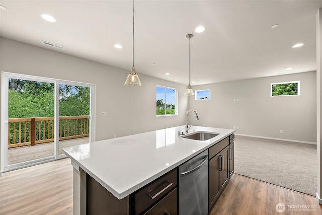 19504 15th Ave E, Spanaway, WA 98387 - kitchen with dishwasher, healthy amount of natural light, light countertops, light wood-style flooring, and recessed lighting