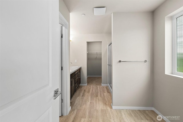 19504 15th Ave E, Spanaway, WA 98387 - full bathroom featuring vanity, wood finished floors, and a shower with shower door