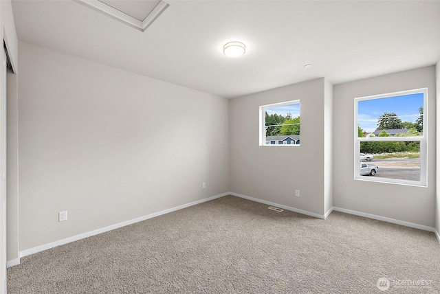 19504 15th Ave E, Spanaway, WA 98387 - carpeted empty room with baseboards