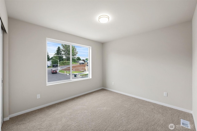 19504 15th Ave E, Spanaway, WA 98387 - carpeted empty room with baseboards