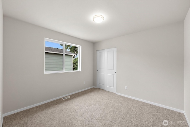 19504 15th Ave E, Spanaway, WA 98387 - carpeted spare room with baseboards